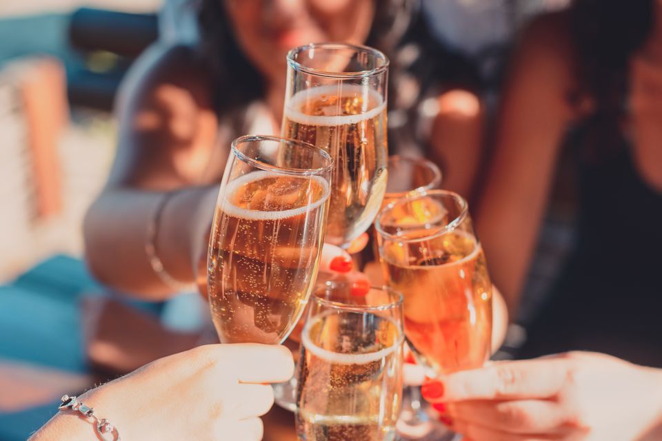 Women toasting with champagne glasses