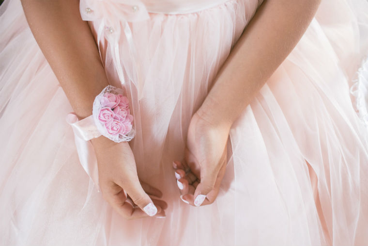 A girl with a prom corsage on her wrist